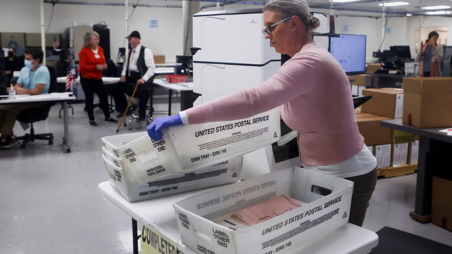 Ballots for the U.S. midterm elections are counted with a machine at the Maricopa County Tabulation and Election Center in Phoenix, Arizona, U.S., November 10, 2022.