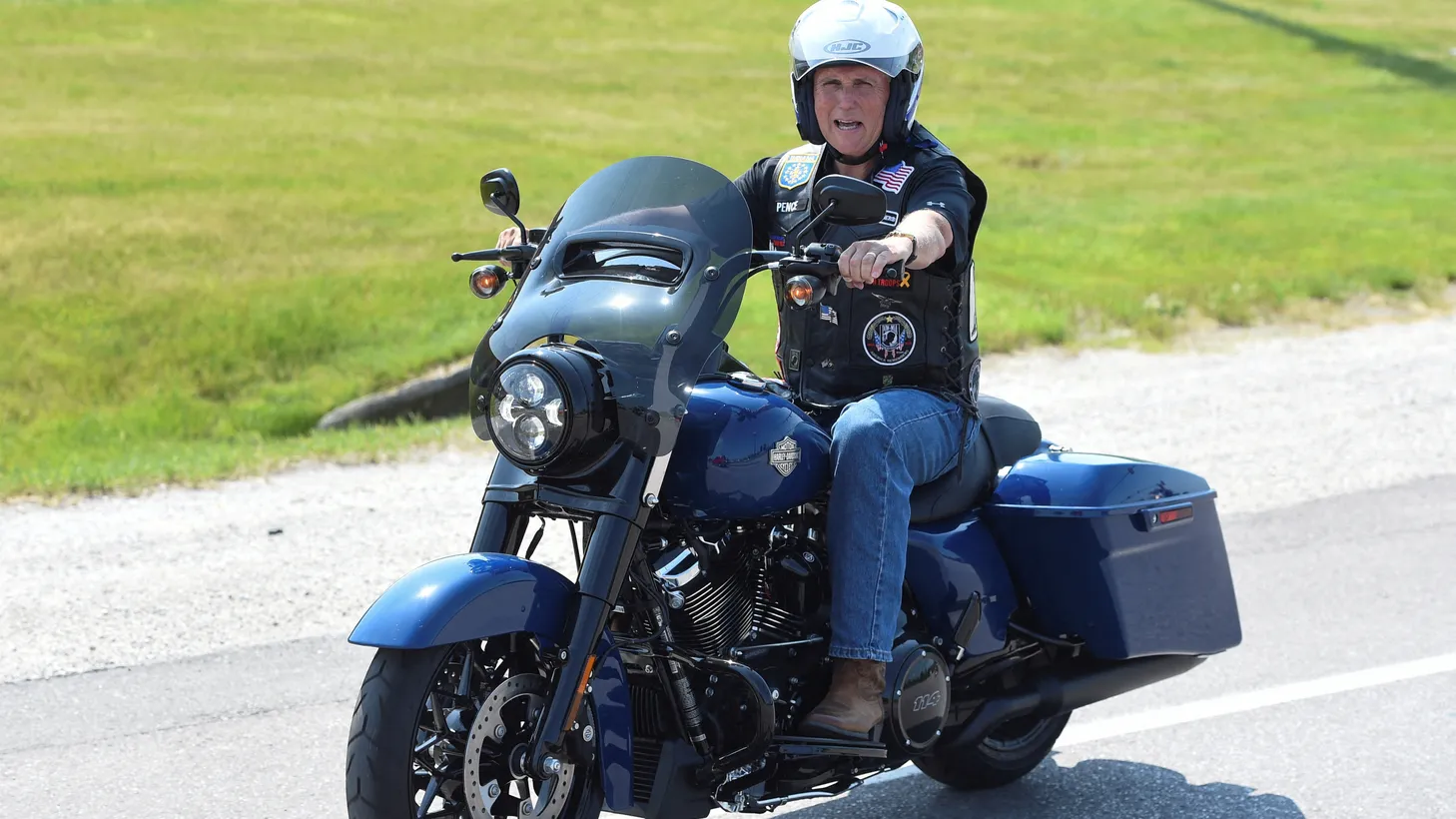 U.S. Republican presidential candidate and former U.S. Vice President Mike Pence rides a motorcycle during the "Roast and Ride" event hosted by U.S. Senator Joni Ernst in Des Moines, Iowa, U.S. June 3, 2023.