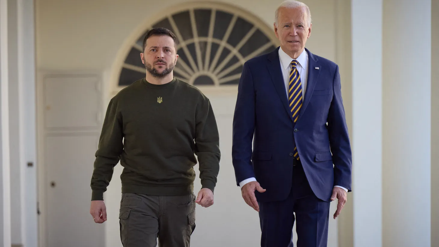 Handout photo shows President Joe Biden walking with Ukraine President Volodymyr Zelensky down the colonnade before meeting in the Oval Office of the White House, December 21, 2022 in Washington DC, USA.