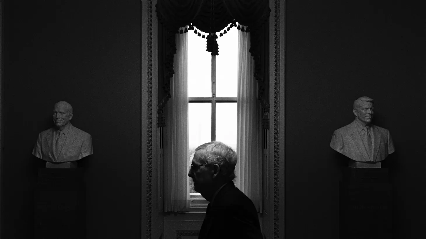 Senate Minority Leader Mitch McConnell stands outside the Senate Chamber in Washington, D.C., on February 28, 2024.