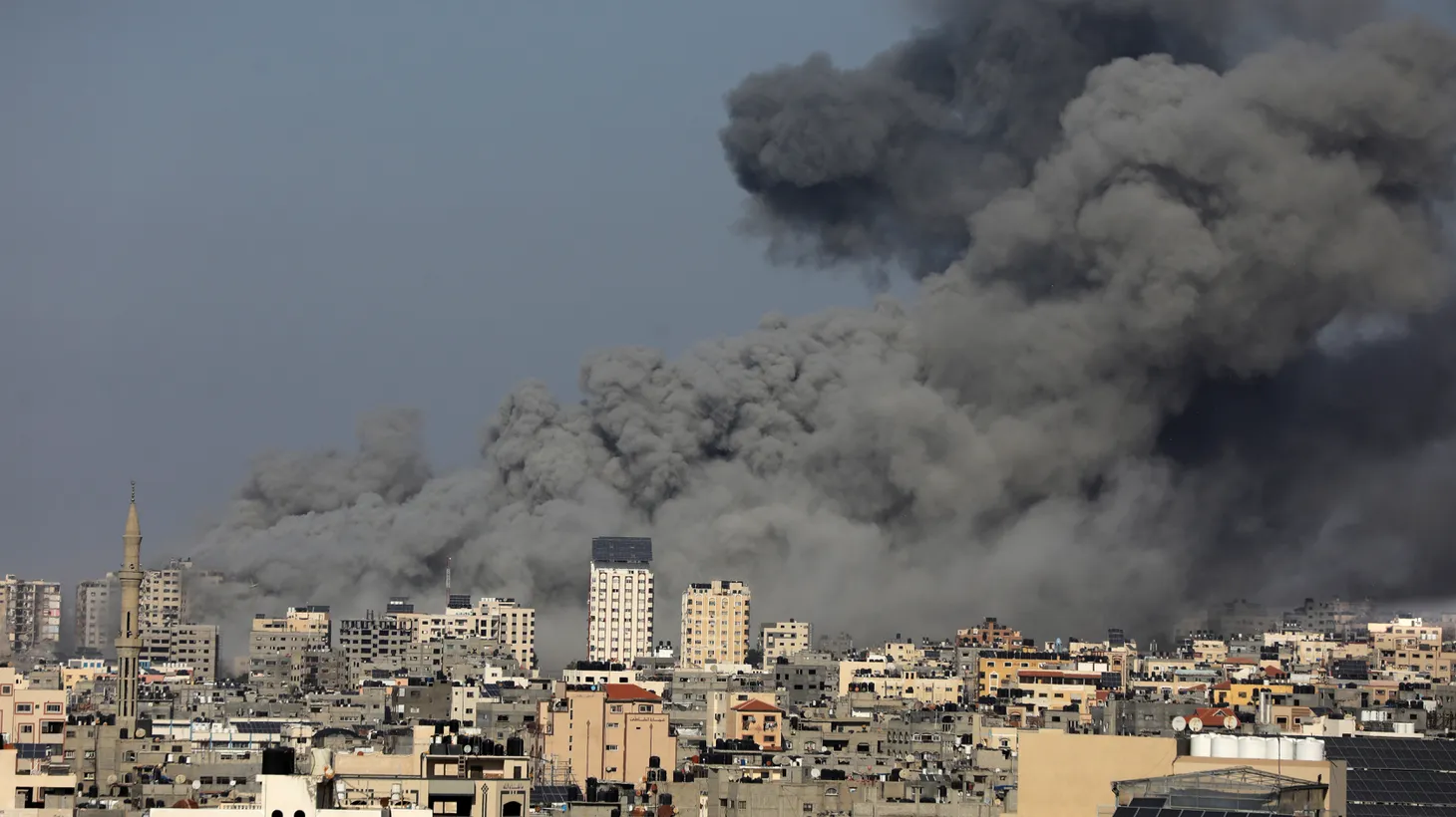 Smoke billows during Israeli air strikes in Gaza City on October 12, 2023.