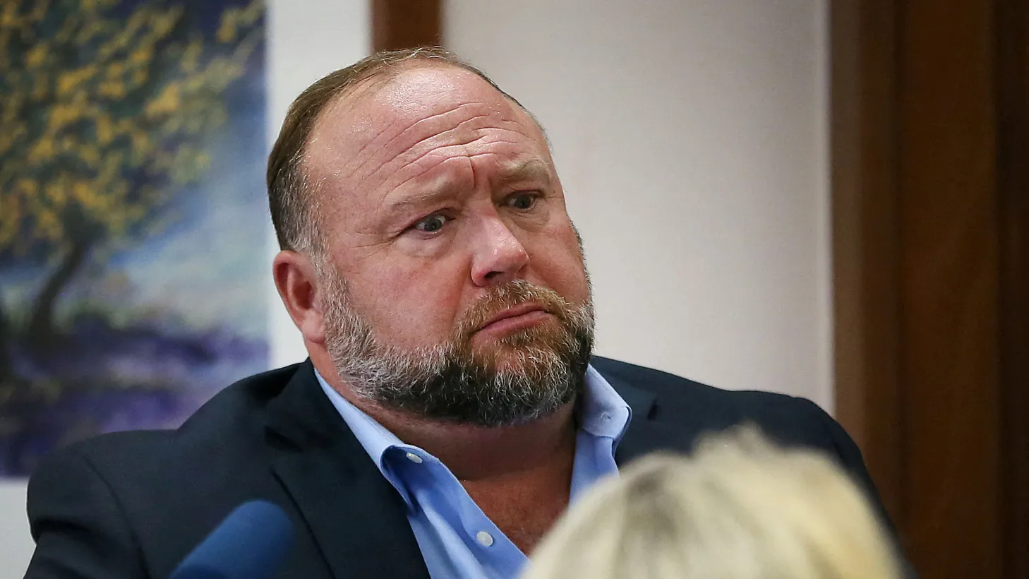 Alex Jones attempts to answer questions about his emails. Mark Bankston, lawyer for Neil Heslin and Scarlett Lewis, asked those questions during a trial at the Travis County Courthouse, Austin, Texas, U.S., August 3, 2022.