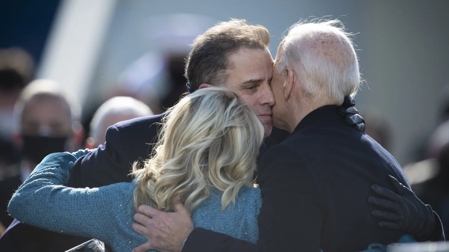 President Joe Biden hugs his family during the 59th Presidential Inauguration ceremony in Washington, Jan. 20, 2021.