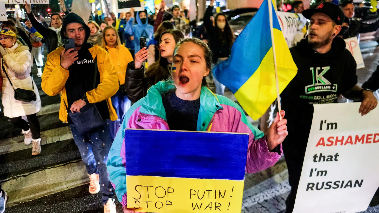 Members of the Russian community march during a demonstration against Russia, after it launched a massive military operation against Ukraine, in Los Angeles, California, U.S., February 24, 2022.