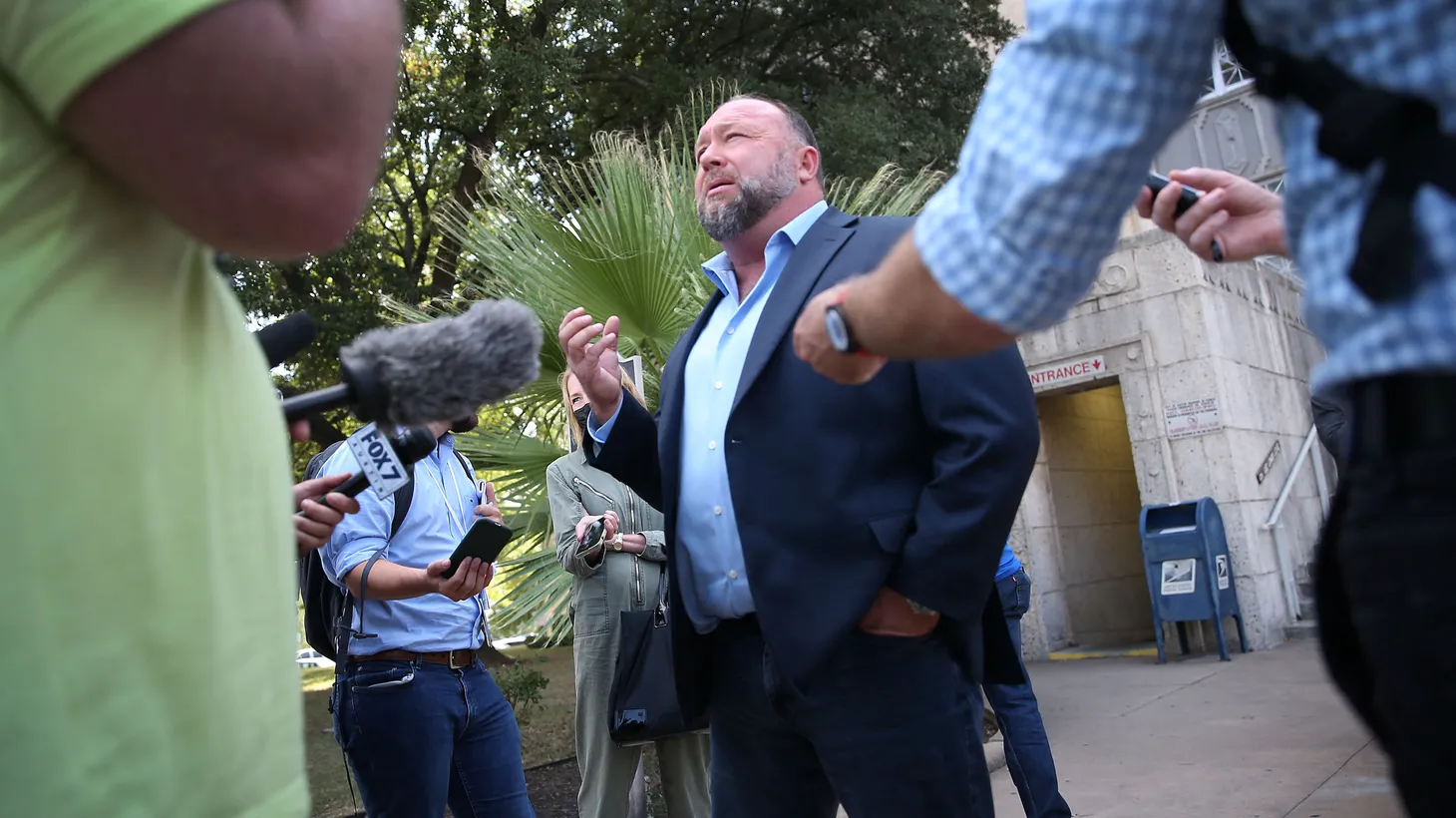 Alex Jones steps outside of the Travis County Courthouse to speak with media after he was questioned under oath about text messages and emails by lawyer Mark Bankston, in Austin, Texas, U.S. August 3, 2022.