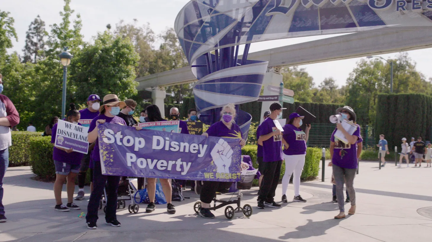 Disneyland workers demonstrate and call for better wages and working conditions outside the park in Anaheim.