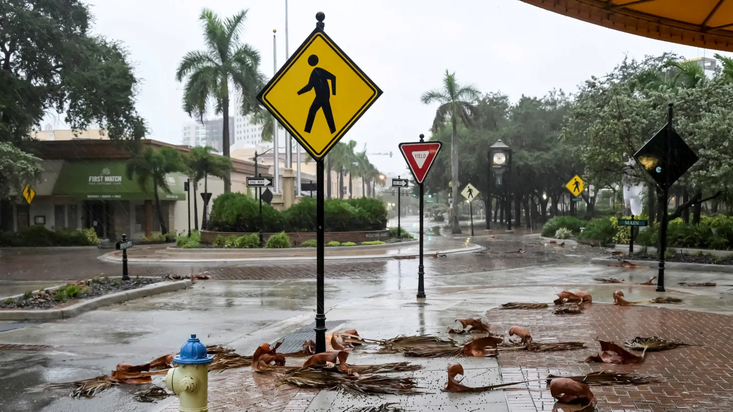 Downed palm fronds collect on an empty downtown intersection as Hurricane Ian approaches Florida’s Gulf Coast in Sarasota, Florida, U.S. September 28, 2022.