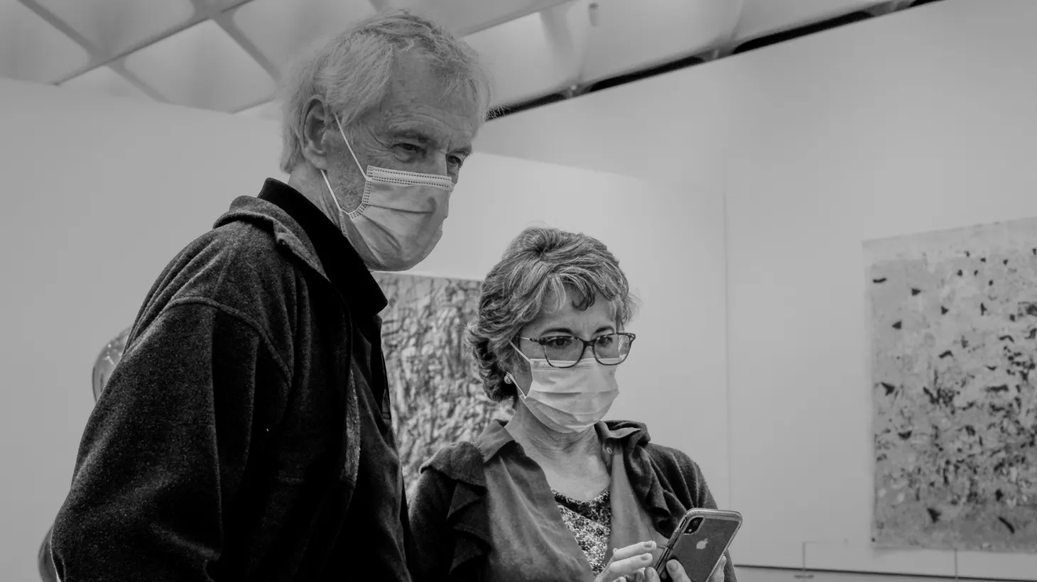 Two people wear face masks inside the Broad Museum in downtown Los Angeles, October 14, 2022.
