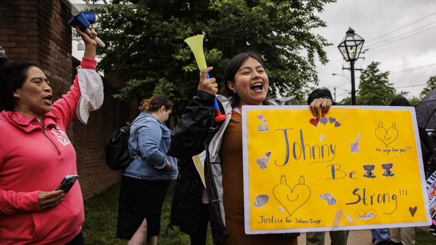 Fans of actor Johnny Depp wait for him to arrive at the Fairfax Circuit Court on May 24, 2022 in Fairfax, Va.