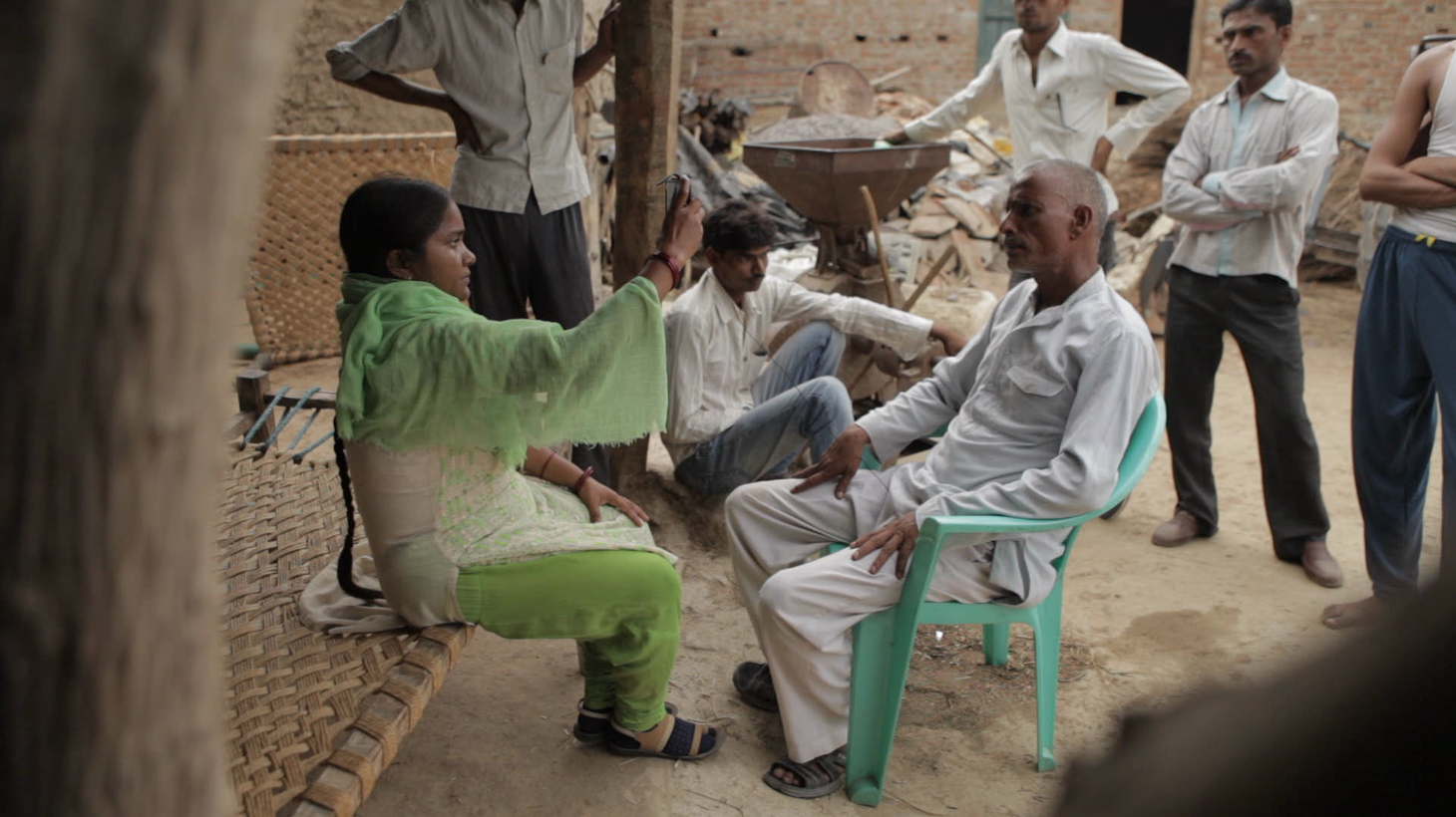 Meera Devi interviews the family member of a victim of an accident at an illegal mine.