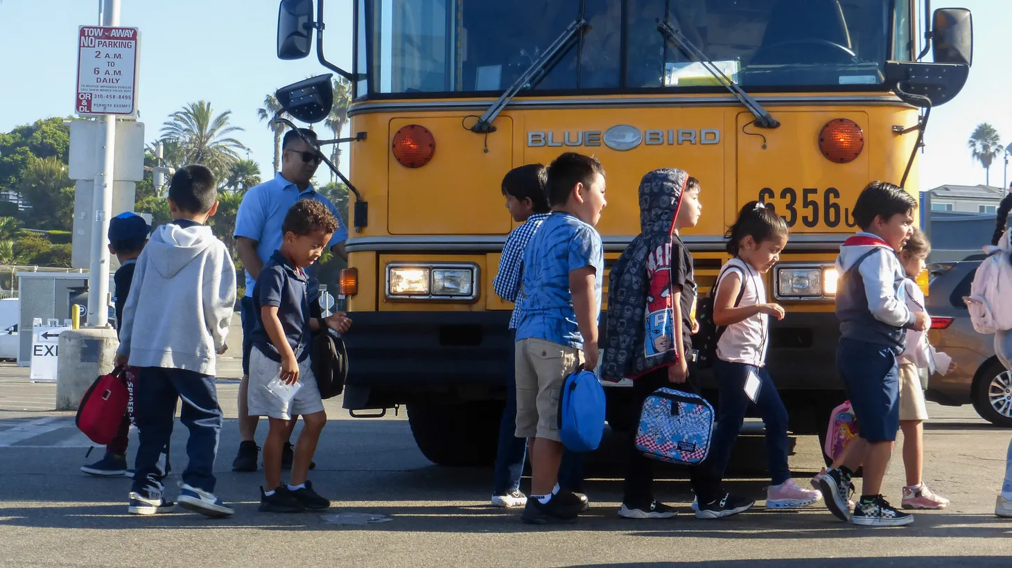 Students deboard a Los Angeles Unified School District bus at Santa Monica Pier, CA.