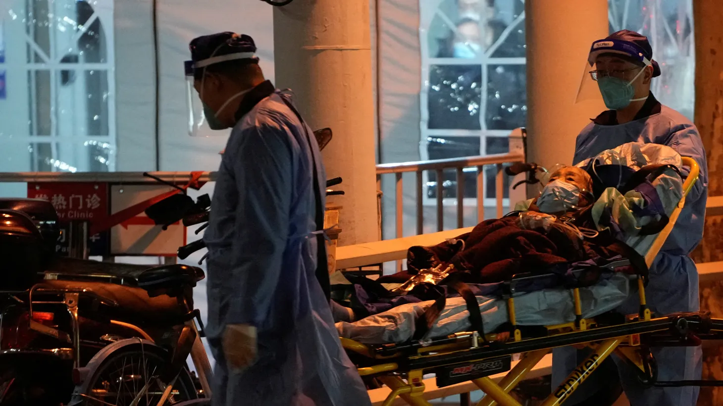 Medical staff members move a patient into a fever clinic at a hospital, as coronavirus disease (COVID-19) outbreaks continue in Shanghai, China, December 19, 2022.