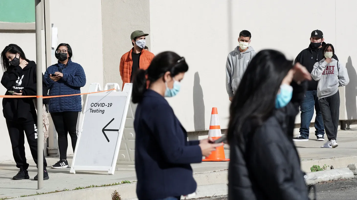 People queue in line at a coronavirus disease (COVID-19) testing site, as the Omicron variant threatens to increase case numbers after the Christmas holiday break, in the Lincoln Heights neighborhood of Los Angeles, California, U.S. December 27, 2021.