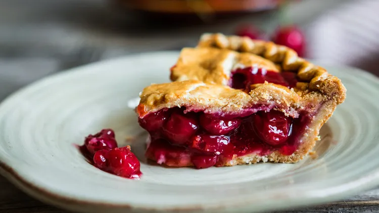 A proper cherry pie is made with sour, not sweet, cherries. You want a flaky, buttery crust and a nicely thickened filling. Here’s a recipe to try.