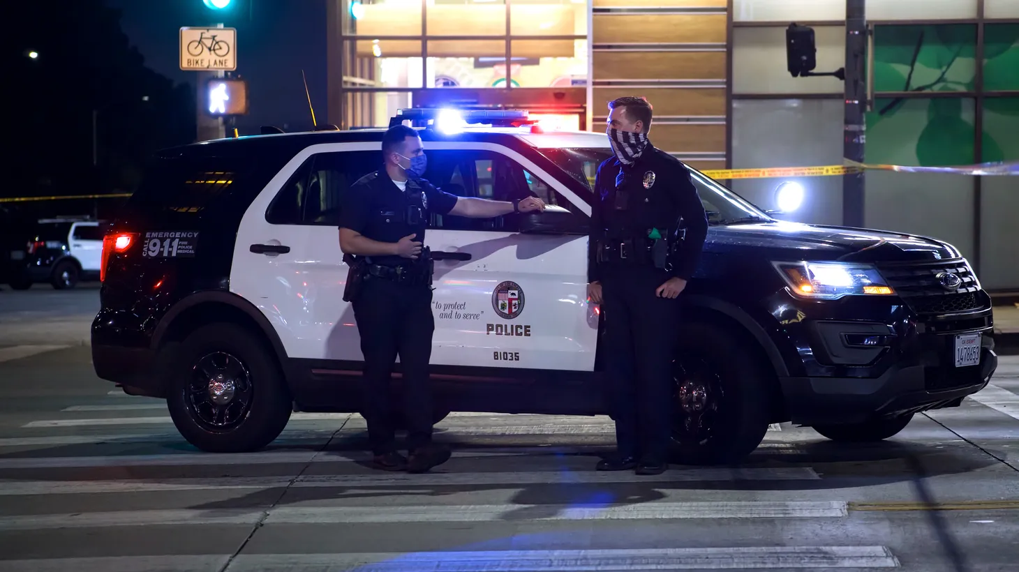 LAPD officers guard Sunset Blvd. in West Hollywood following an officer-involved shooting, April 24, 2021.