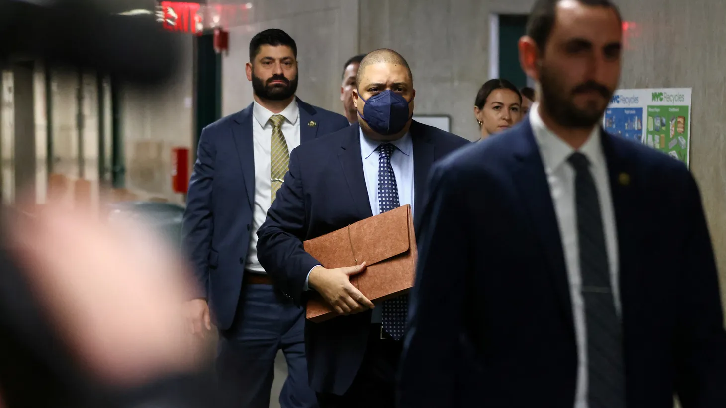 Manhattan District Attorney Alvin Bragg (center, masked) arrives for the sentencing hearing of the Trump Organization at the Manhattan Criminal Courthouse in New York City, U.S. January 13, 2023.