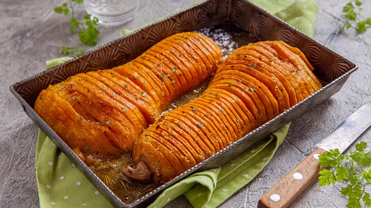 For your holiday table, cut a long-necked butternut squash in thin slices but not all the way through. This hasselback style allows the glaze to penetrate.