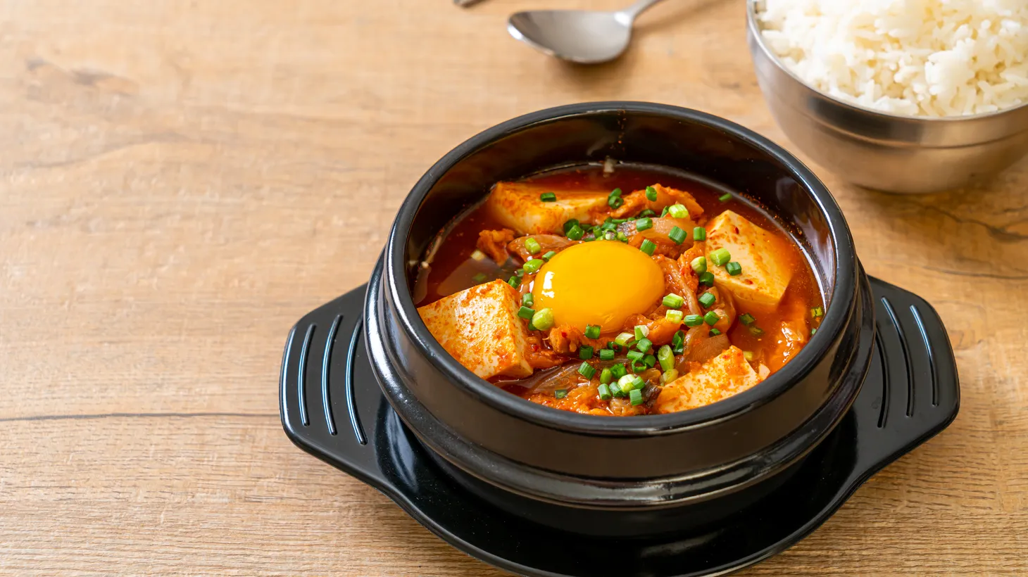 Hot tofu soup is perfect as winter approaches. You can make your own with recipes from “Sohn-mat: Recipes and Flavors of Korean Home Cooking.”