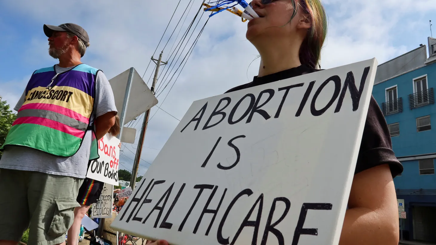 An abortion rights activist blows a horn outside the Jackson Women's Health Organization in Jackson, Mississippi, U.S. on July 6, 2022.