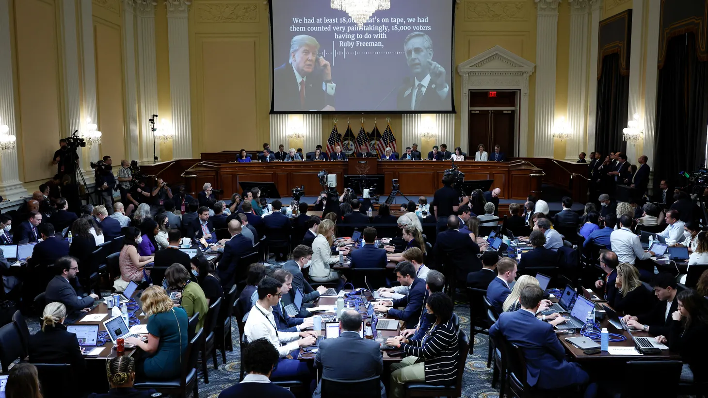A transcript of a phone call between former U.S. President Donald Trump and Georgia Secretary of State Brad Raffensperger appears on a video screen during the fourth public hearing of the U.S. House Select Committee to investigate the January 6, 2021 attack on the U.S. Capitol, in Washington, D.C., June 21, 2022.
