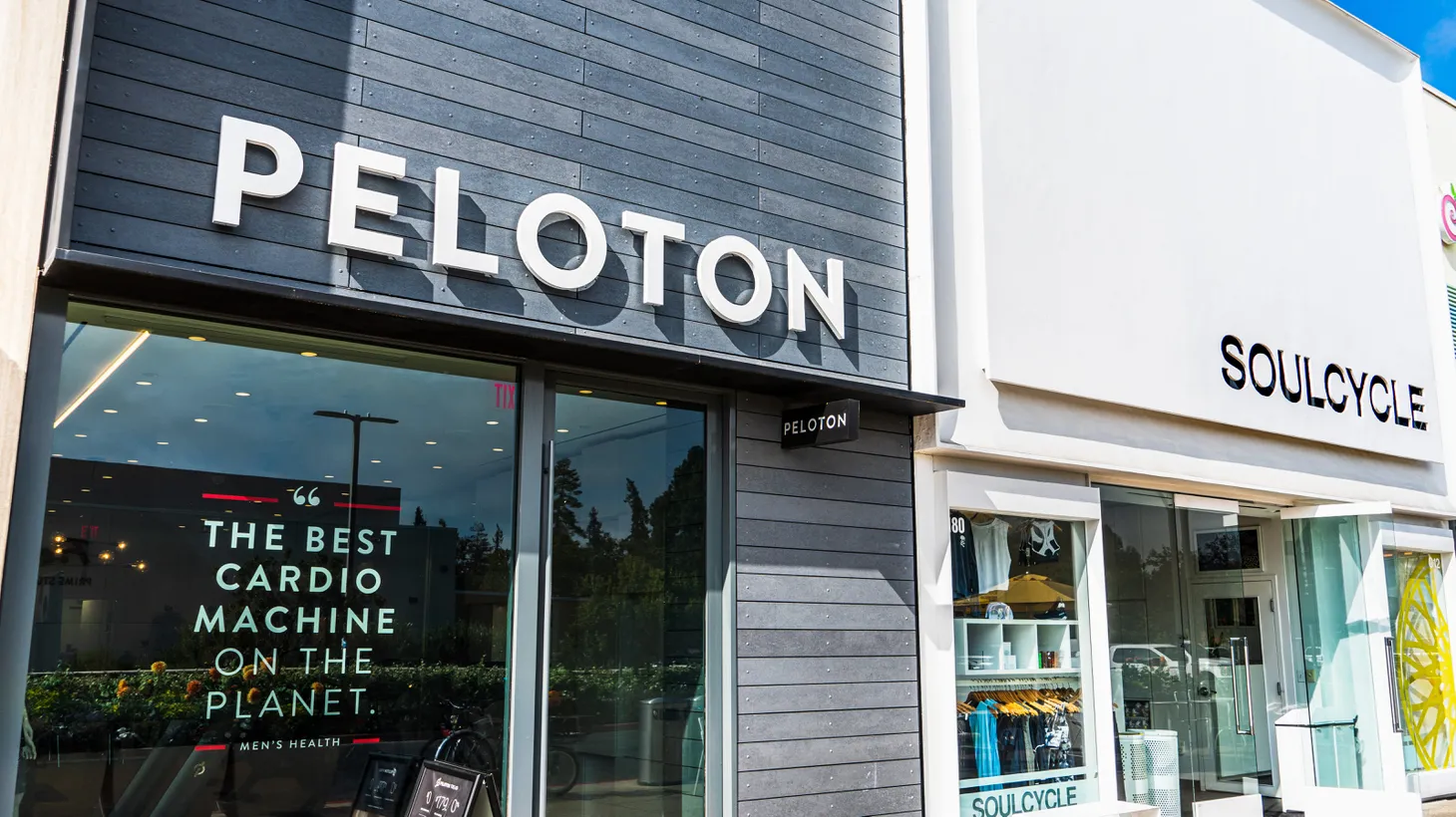 Peloton and Soulcycle stores are located next to each other in a Stanford shopping center. Both companies have faced economic losses and must reconsider how they’ll operate going forward.
