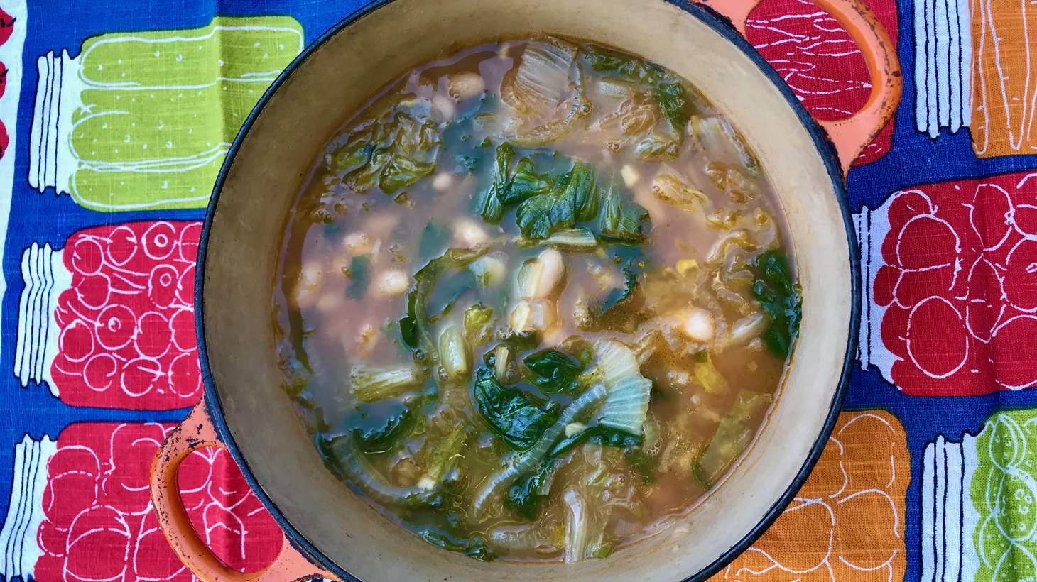 Minestra di Scarole e Fagioli, which includes escarole and white beans, is an easy and comforting Italian soup.