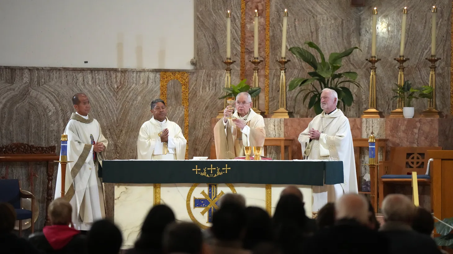 Auxiliary Bishop for the San Gabriel Region of the Archdiocese of Los Angeles David G. O'Connell (far right) participates in a mass for shooting victims at the St. Stephen Martyr Catholic Church on Jan. 27 2023, in Monterey Park, Calif.