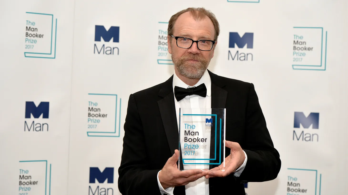 George Saunders, author of “Lincoln in the Bardo,” poses for photographers after winning the Man Booker Prize for Fiction 2017 in London, Britain, October 17, 2017.