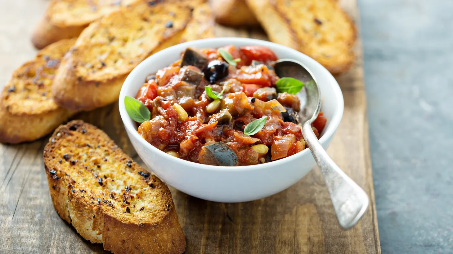 Caponata is a sweet and sour Sicilian vegetable dish that’s an ode to the purple orb.