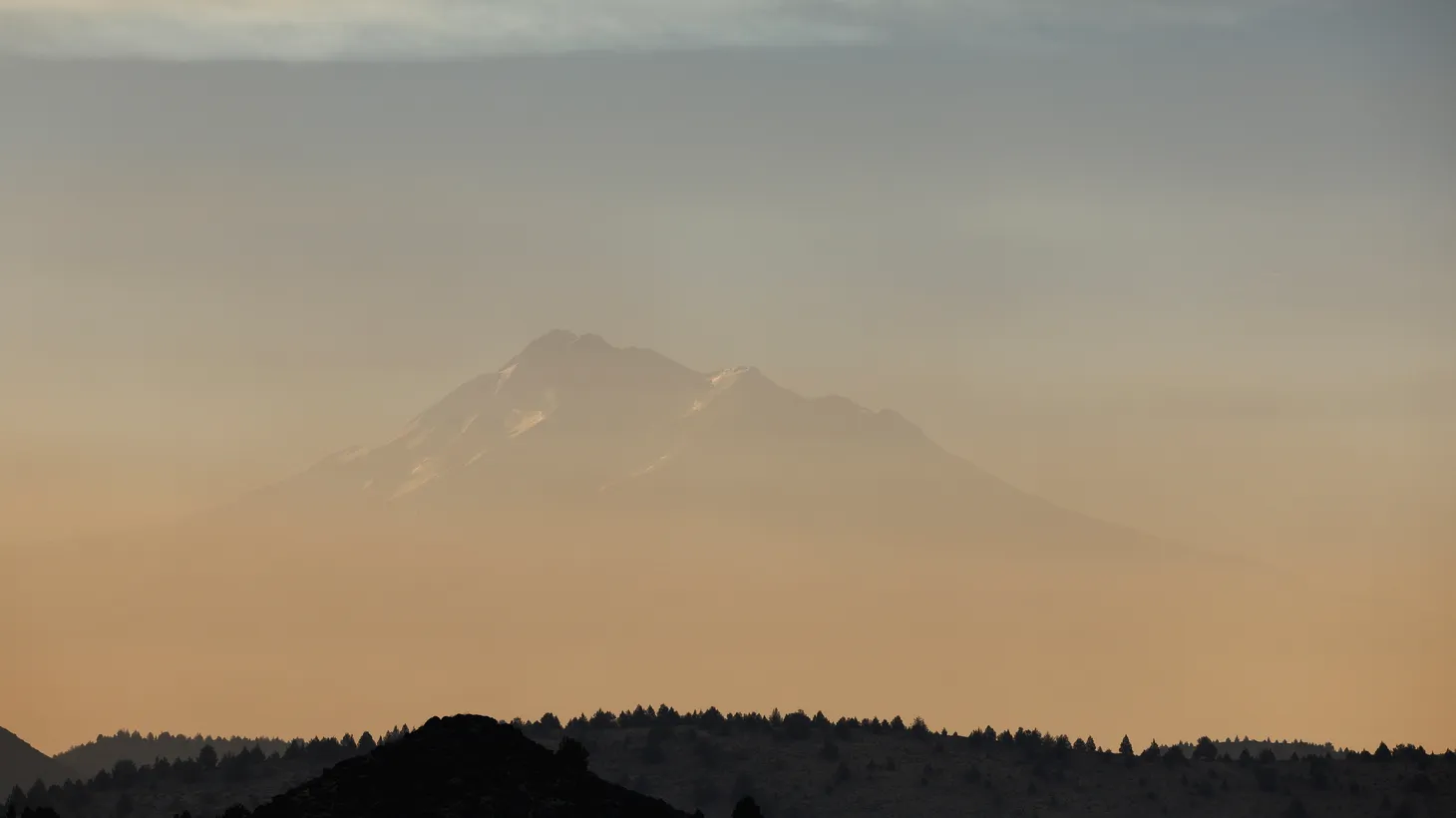 Mill Fire smoke (below) and Mountain Fire smoke (above) obscure Mount Shasta, in Siskiyou County, California, U.S., September 3, 2022.
