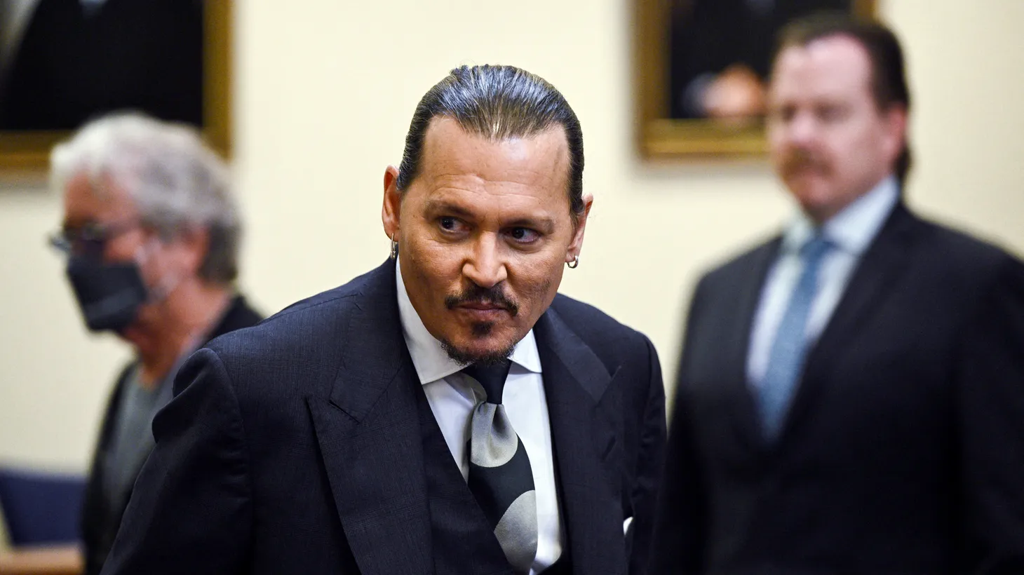 Actor Johnny Depp returns to the courtroom after a break during his defamation case against ex-wife Amber Heard at the Fairfax County Circuit Court in Fairfax, Virginia, U.S., April 14, 2022.