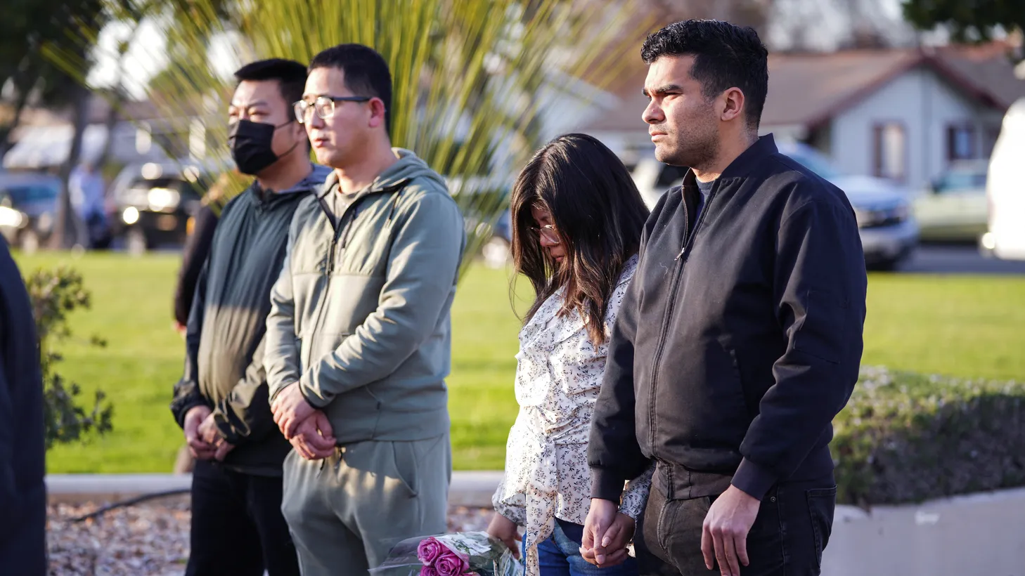 Members of the community hold a prayer vigil near the scene of a shooting that took place during a Lunar New Year celebration, in Monterey Park, California, U.S. January 22, 2023.