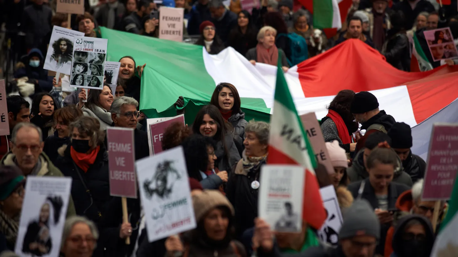 Protesters wave a giant Iranian flag, December 3 2022. Iranians of Toulouse organized a protest in solidarity with women in Iran, following the death of Mahsa Amini, who died after being arrested by the Islamic republic's “morality police.”