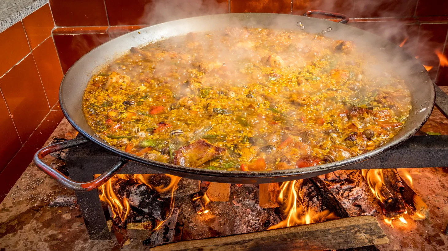 Paella — also called “rice with the stuff” — is ideal for entertaining