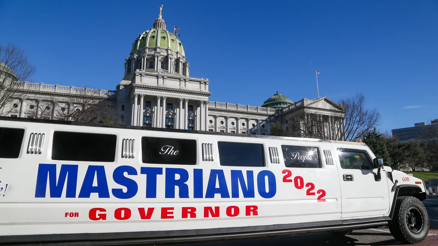 A Hummer stretch limousine is parked at the Pennsylvania State Capitol during Doug Mastriano's rally against vaccine mandates in Harrisburg, Pennsylvania on December 14, 2021.