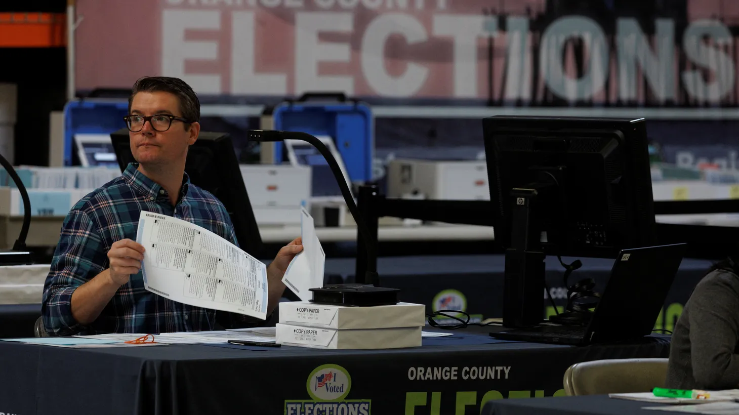 Election workers verify ballots at the Orange County Registrar of Voters in Santa Ana, California, U.S., November 1, 2022.