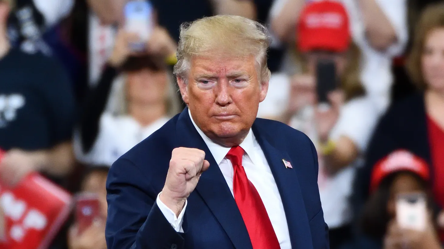 President Donald Trump gestures a confident fist pump onstage at a campaign rally at the Giant Center, Hershey, Pennsylvania, December 10, 2019.