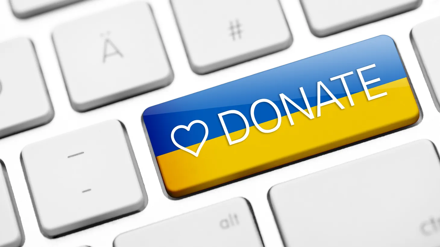A keyboard key is colored with a Ukraine flag and “donate” text.