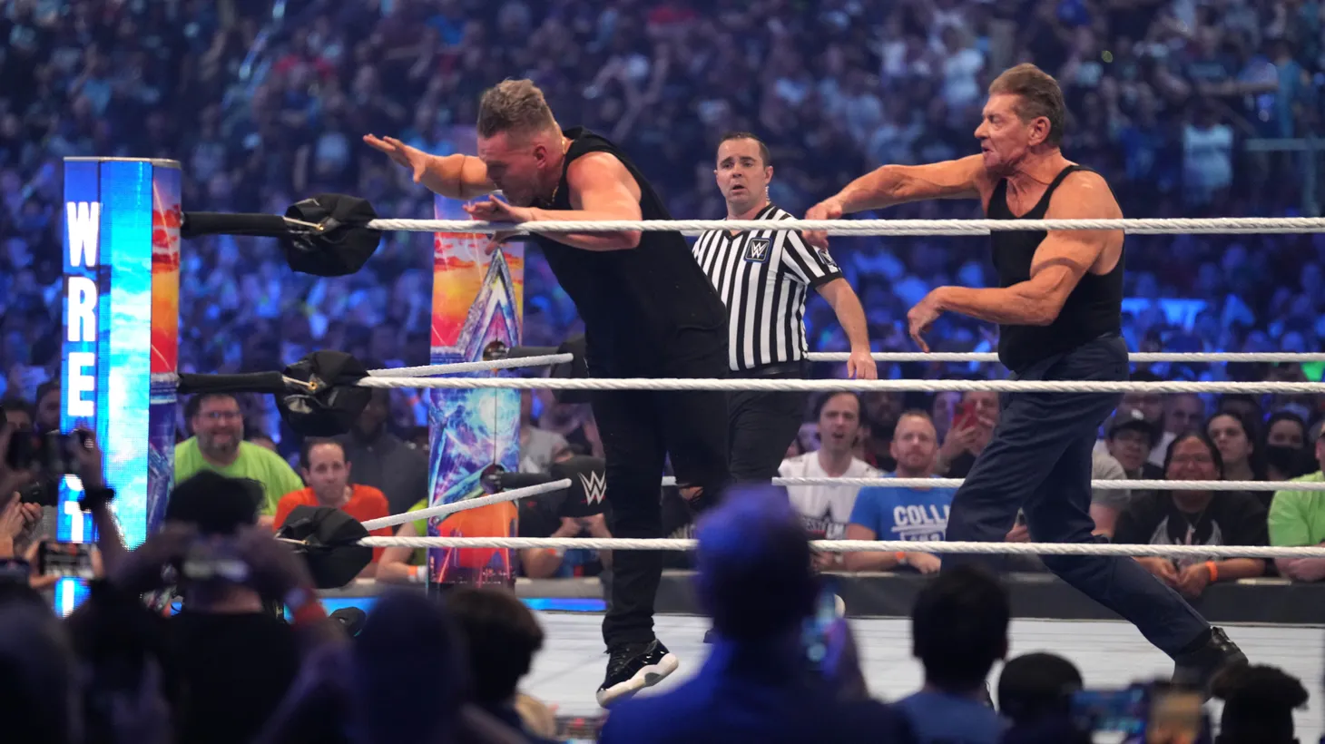 Pat McAfee (left) and WWE owner Vince McMahon wrestle during WrestleMania at AT&T Stadium, Arlington, TX, Apr. 3, 2022. \
