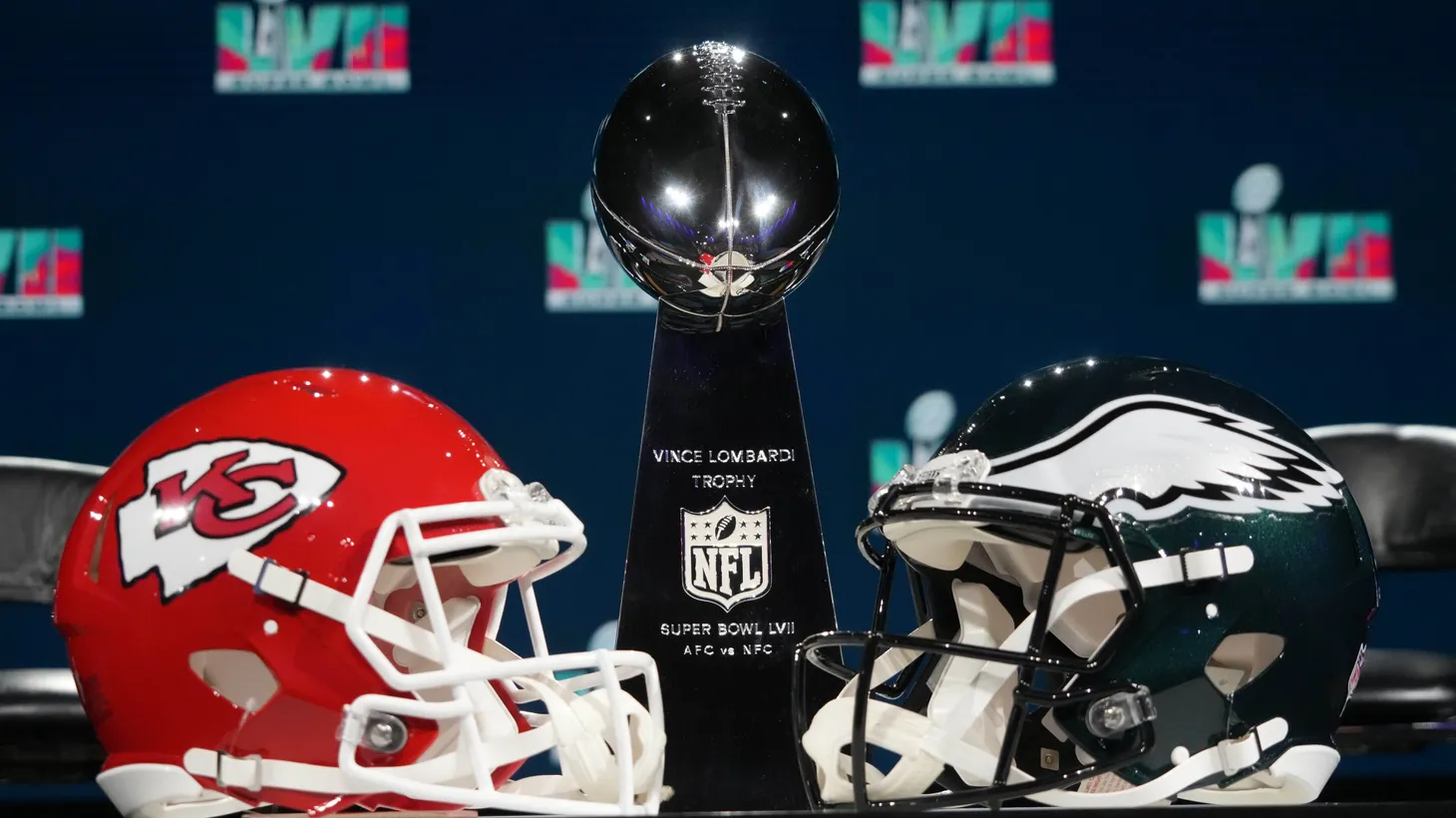 Kansas City Chiefs and Philadelphia Eagles helmets and Vince Lombardi trophy are displayed at a press conference at Phoenix Convention Center, Feb 8, 2023; Phoenix, AZ.