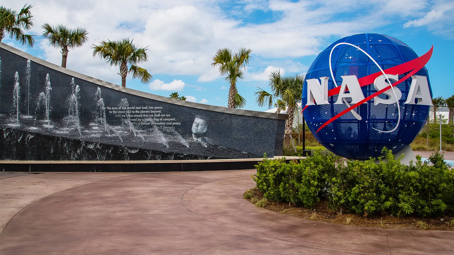 The NASA globe is seen next to the Kennedy memorial at the Space Center in Cape Canaveral, Florida.