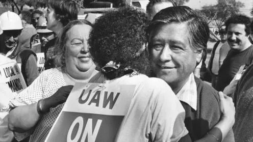 Terry Moore hugs United Farm Workers leader Cesar Chavez at the UAW rally against Douglas aircraft at Long Beach Park (Wardlow Park).