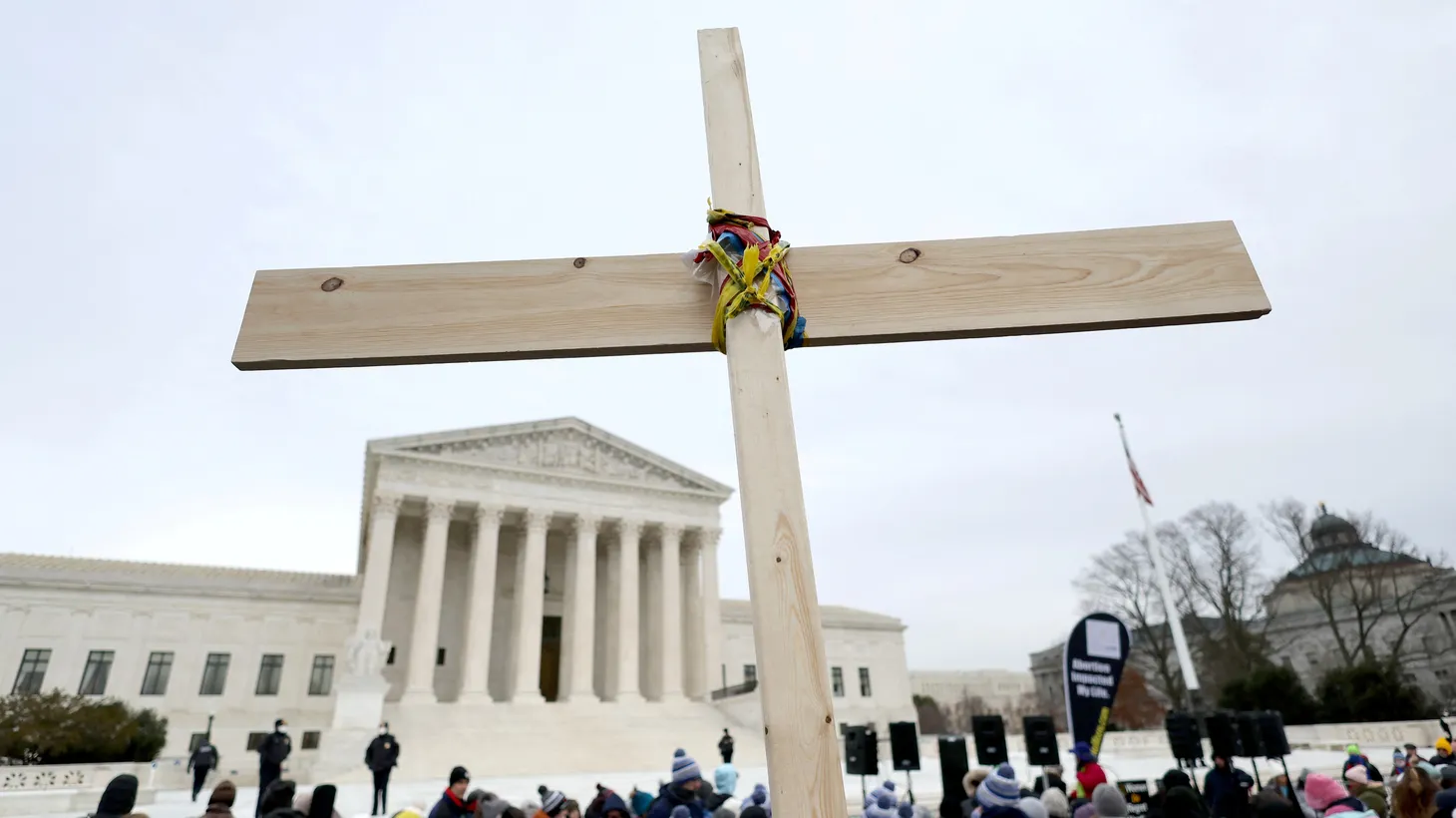 Activists hold a cross in front of the U.S. Supreme Court building in Washington, U.S., January 21, 2022.