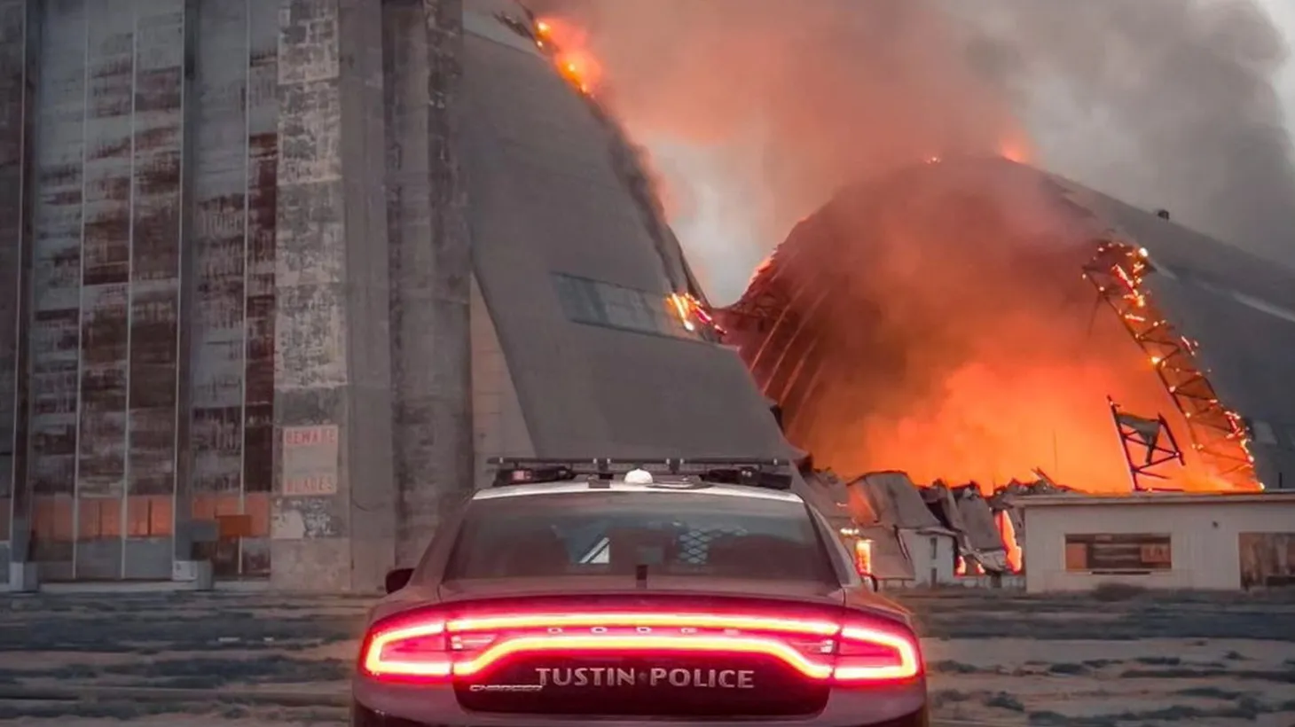 A fire burns at a former Air Base hangar in Tustin, California, U.S., November 7, 2023.
