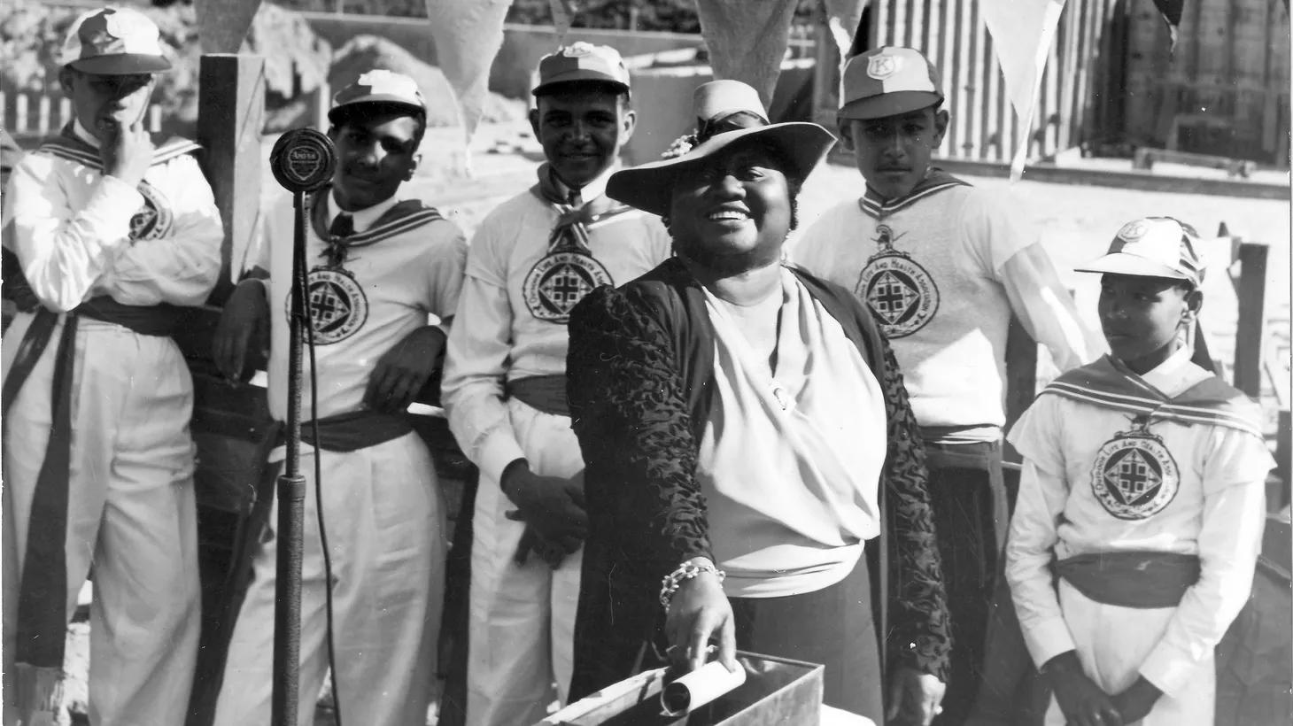 Hattie McDaniel and boys from the Los Angeles Health Club attend the Val Verde Park swimming pool cornerstone installation ceremony, April 16, 1939.