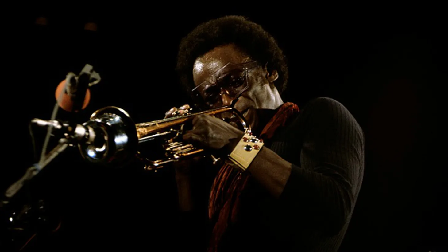 American jazz trumpeter and composer Miles Davis (1926-1991) performs live on stage in Berlin, West Germany in November 1973.