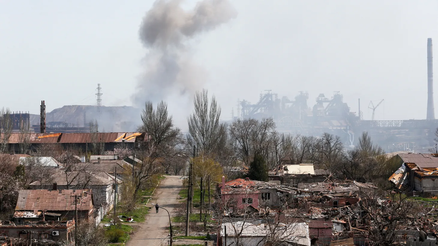 Smoke rises above a plant of Azovstal Iron and Steel Works. Buildings are damaged during the Ukraine-Russia conflict in the southern port city of Mariupol, Ukraine, April 18, 2022.