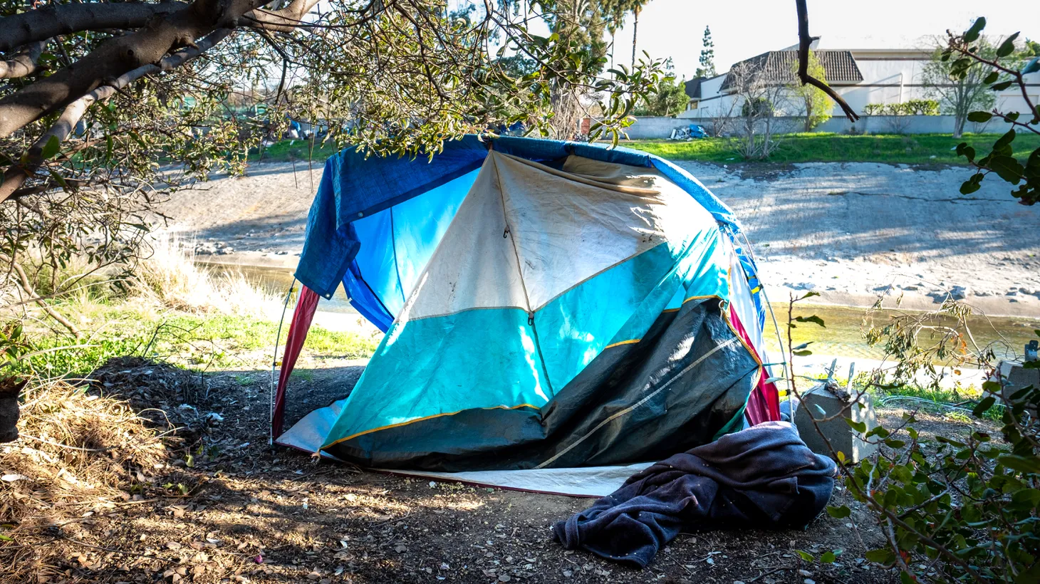 A small homeless camp is set up along the Ballona Creek river path in Culver City, California, Feb. 4, 2022.