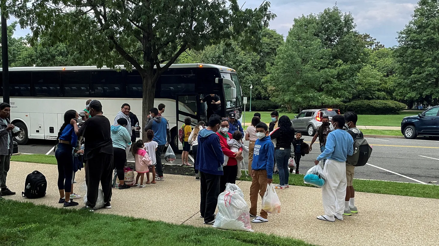 Approximately 30 migrants disembark after arriving on a bus from Texas, at Union Station near the U.S. Capitol in Washington, U.S., July 29, 2022.