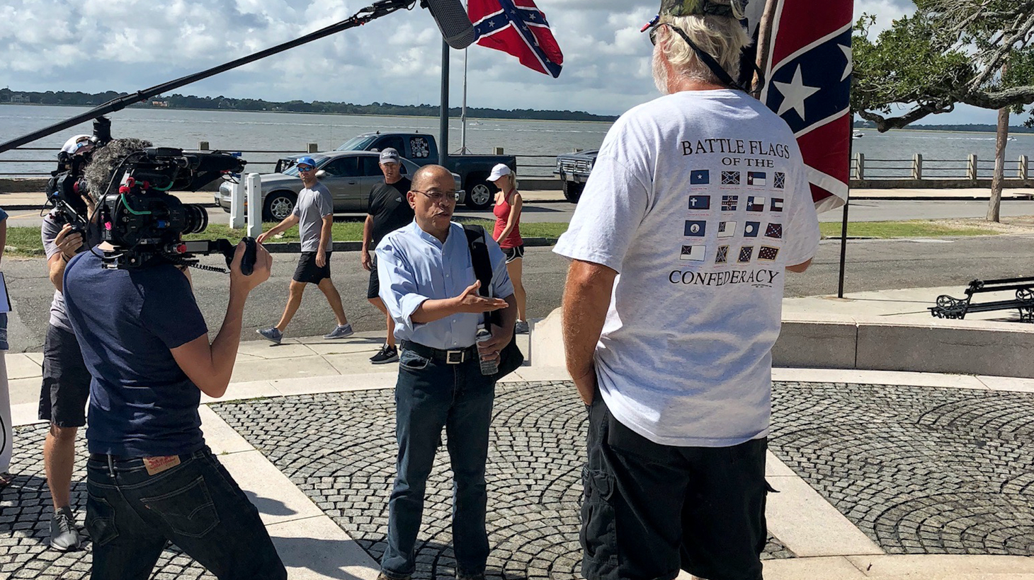 Jeffery Robinson talks with Confederate flag defender Braxton Spivey at a monument near Fort Sumter in Charleston, South Carolina. Photo by Sarah Kunstler.